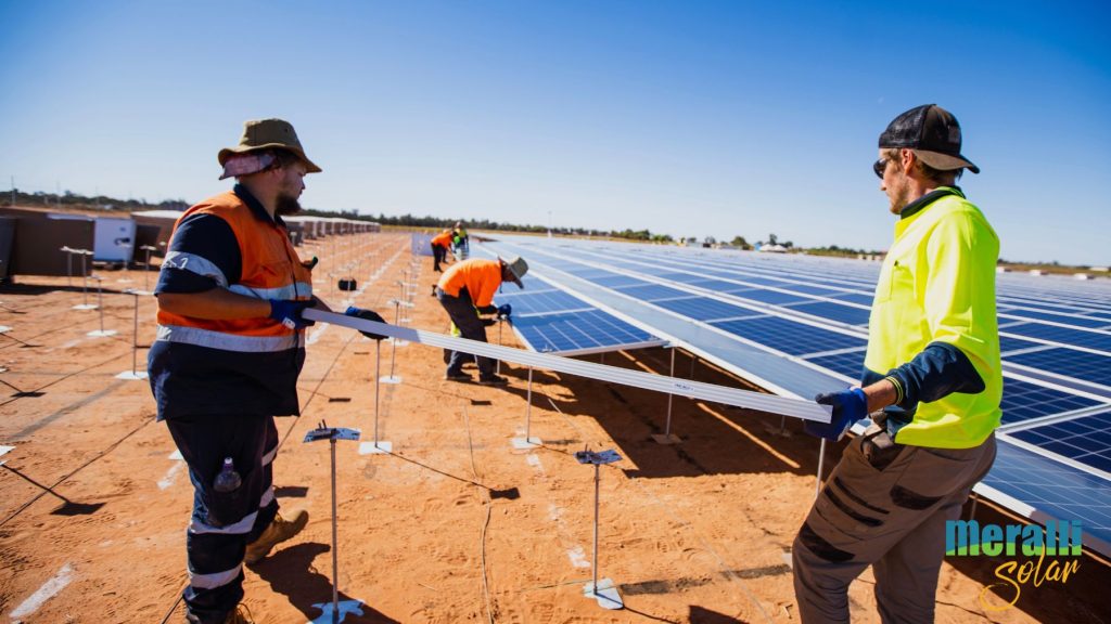 Panel lift process shown by Meralli Solar workers onsite